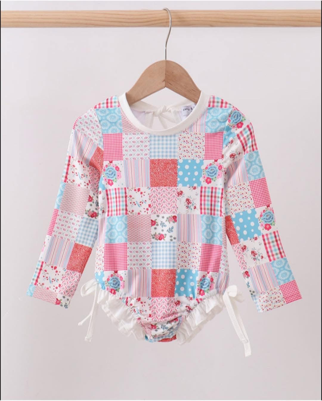 Pink floral patchwork rash guard